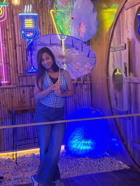 Neon signs and blue-lit seating