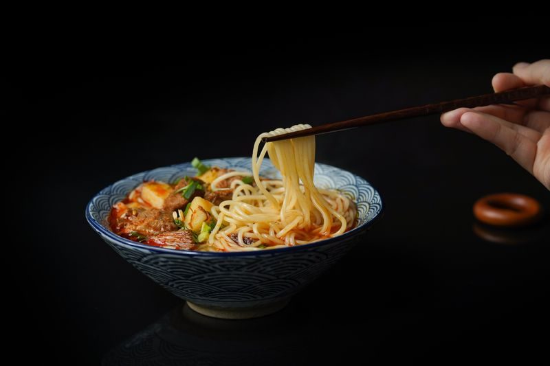 Steaming bowl of ramen with chopsticks